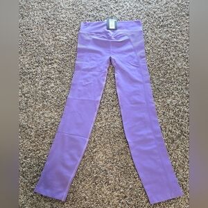 NWT Pisces size S/M color purple yoga pants. Waist is 26